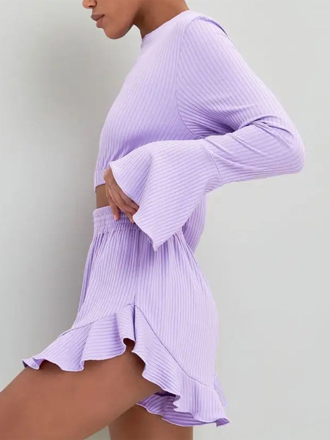 Lavender ribbed crop set with flared sleeves and ruffled shorts.