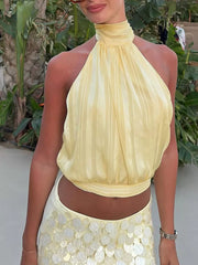 Yellow ruched halter cami top with vertical stripes and a cropped length