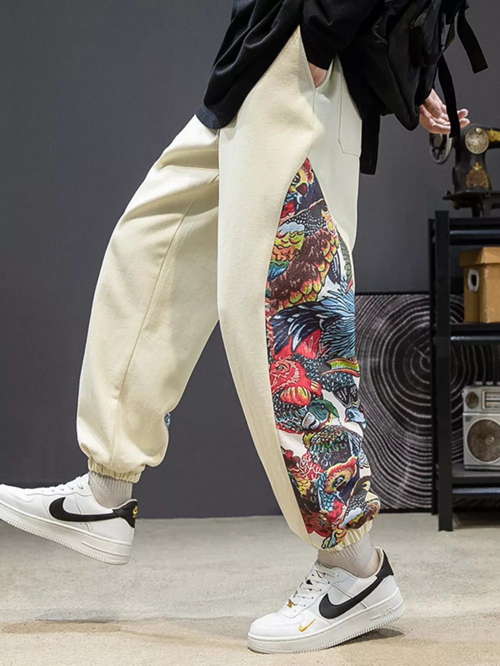 Men's off white joggers with bold side panel print and elastic cuffs