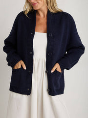 Dark Blue acrylic knit buttoned cardigan with pockets.