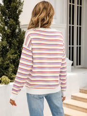Pastel stripe crewneck knit sweater with lavender, white, red, and yellow stripes.