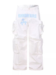 White cargo pants with blue graphic design and multiple pockets.