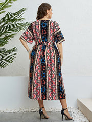 Multicolor geometric print midi dress with tie waist and short sleeves.