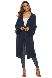 Dark blue oversized sleeve maxi knit cardigan with open front and relaxed fit.
