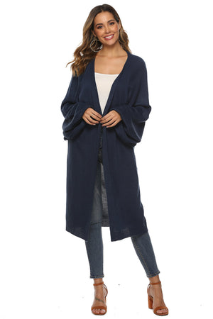 Dark blue oversized sleeve maxi knit cardigan with open front and relaxed fit.