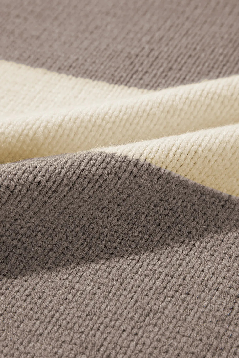 Relaxed knit sweater with bold mocha and cream stripes in an acrylic blend.