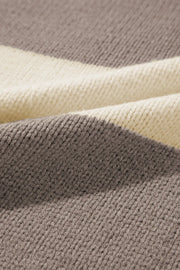Relaxed knit sweater with bold mocha and cream stripes in an acrylic blend.