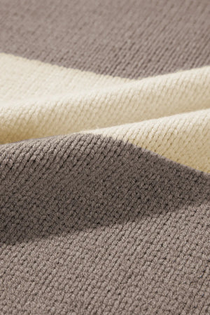 Relaxed knit sweater with bold mocha and cream stripes in an acrylic blend.