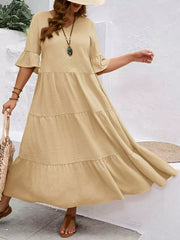 Apricot tiered midi dress with ruffle sleeves and crinkled texture.