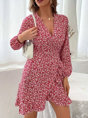 Red floral wrap mini dress with V-neck and ruffled hem.