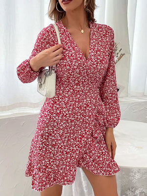 Red floral wrap mini dress with V-neck and ruffled hem.