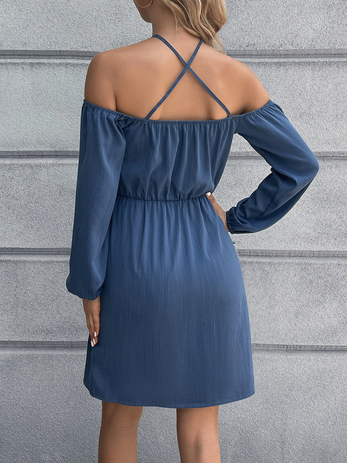 Dusty Blue cross-strap off-shoulder mini dress with long sleeves and elastic waist.