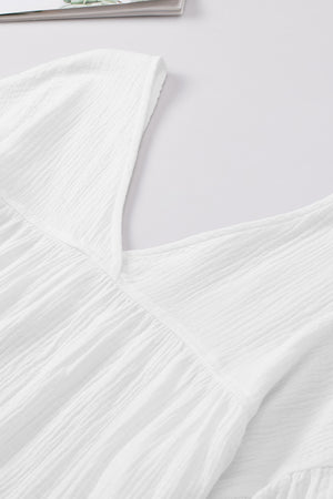 White textured gauze blouse with V-neck and gathered detail