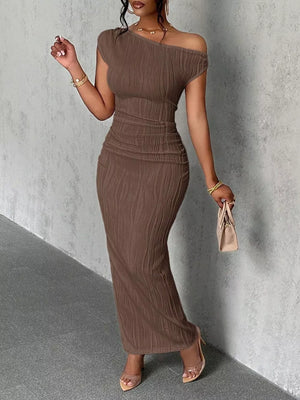 Brown textured one-shoulder maxi dress with ruched detail and asymmetrical neckline.