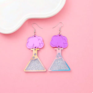 Funky science beaker dangle earrings in fuchsia pink acrylic with glitter accents.