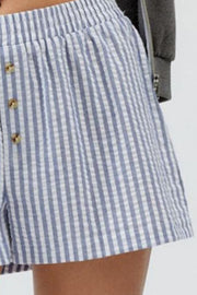 Seersucker boxer shorts in blue and white stripe with button detail and elastic waist.