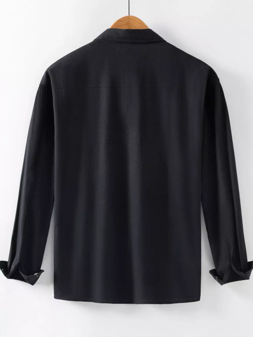Men's black long sleeve button-up shirt with cuffed sleeves.