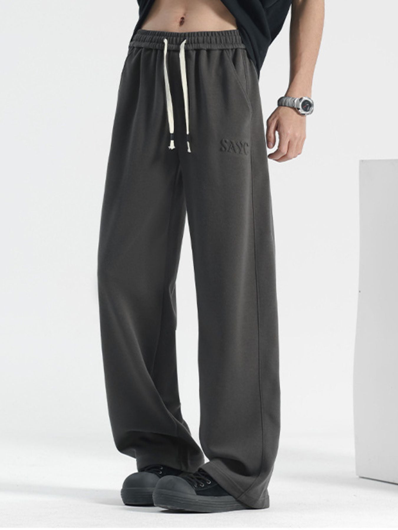 Men's grey casual drawstring sweatpants with embroidered logo detail