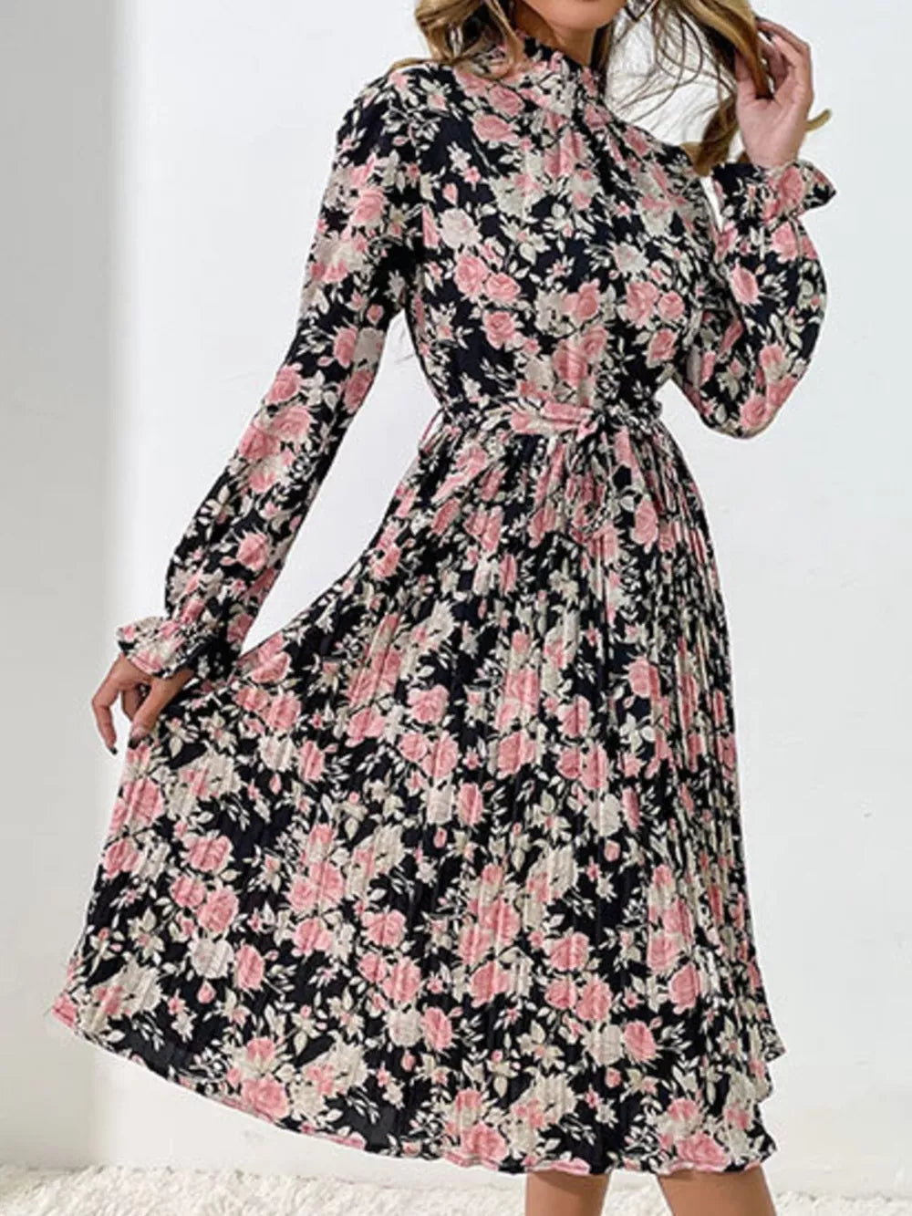 Black floral midi dress with pleated skirt and tie waist.