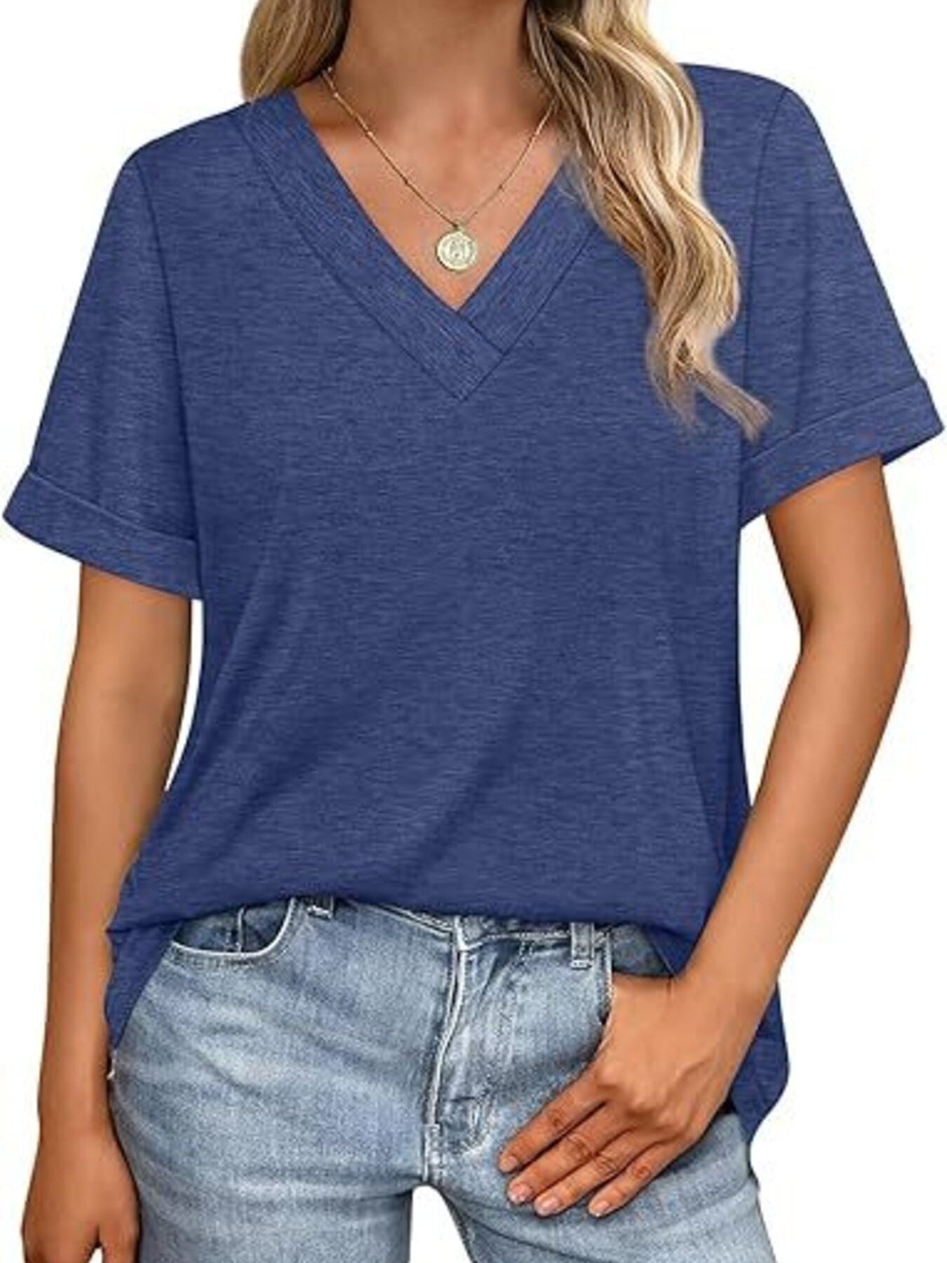 Blue-green v-neck t-shirt with cuffed short sleeves, styled with jeans.
