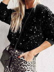 Black sequin embellished sweatshirt with ribbed cuffs and crew neck.