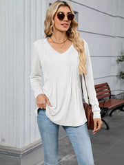 White V-neck long sleeve t-shirt with subtle pleat detail and relaxed fit.