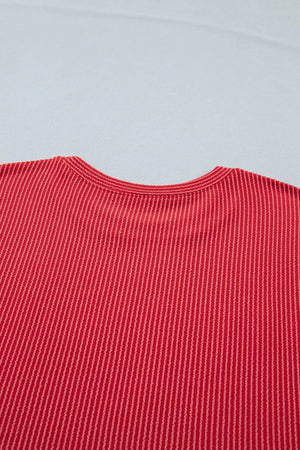 Red twisted rib t-shirt with crew neck and vertical stripe texture.