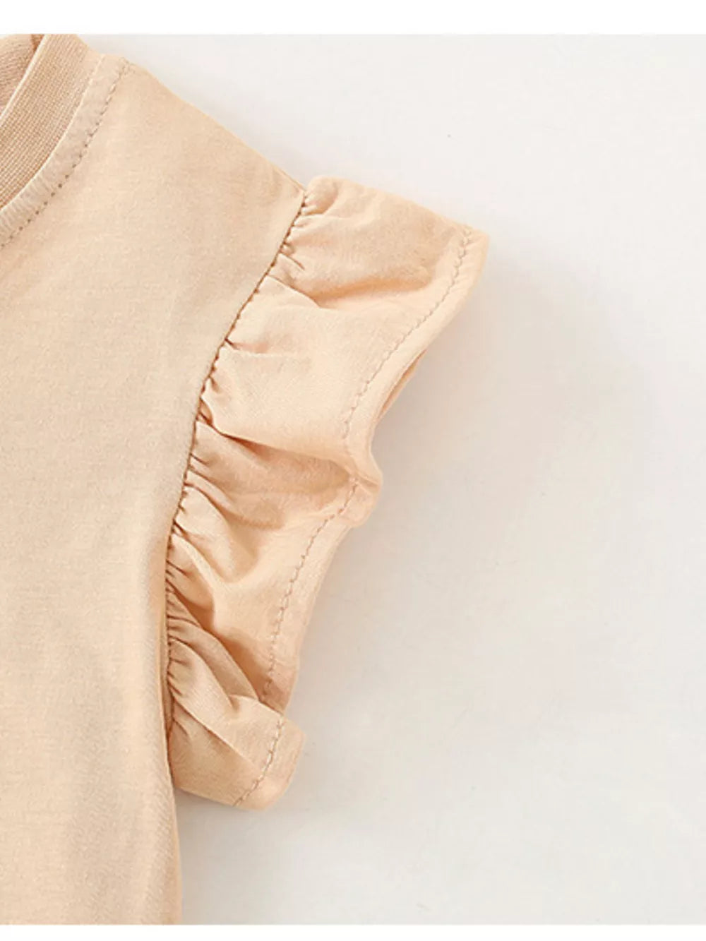 Girls' cotton undershirt in beige with ruffled cap sleeves.