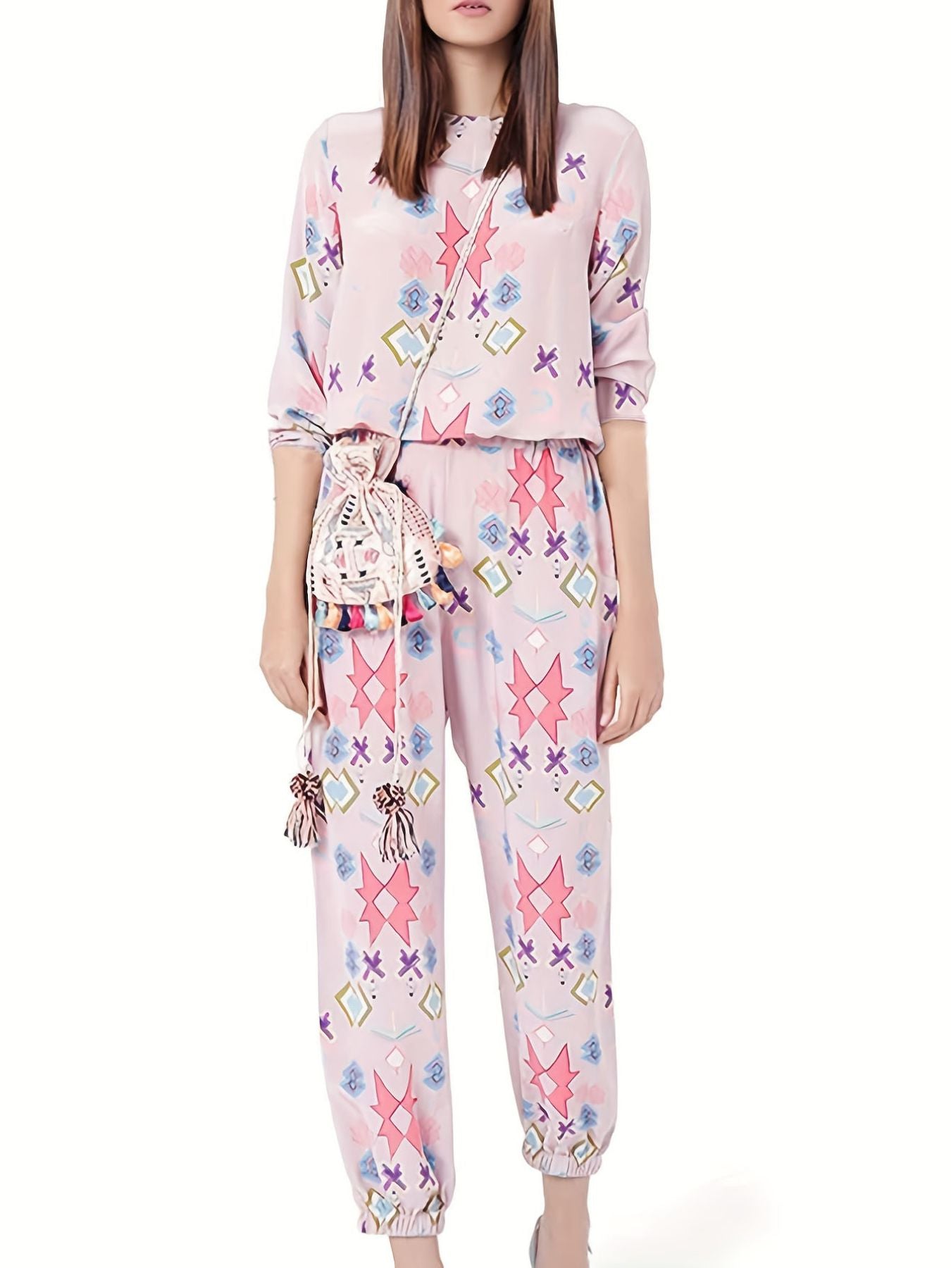 Women's blush pink abstract print lounge set with crew neck top and jogger pants.