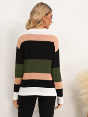 Colorblock crewneck sweater with horizontal stripes in black, army green, peach, and white.