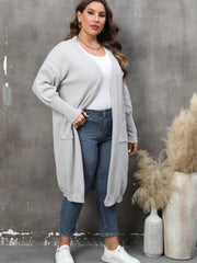 Light gray oversized knit duster cardigan with patch pockets and ribbed cuffs.