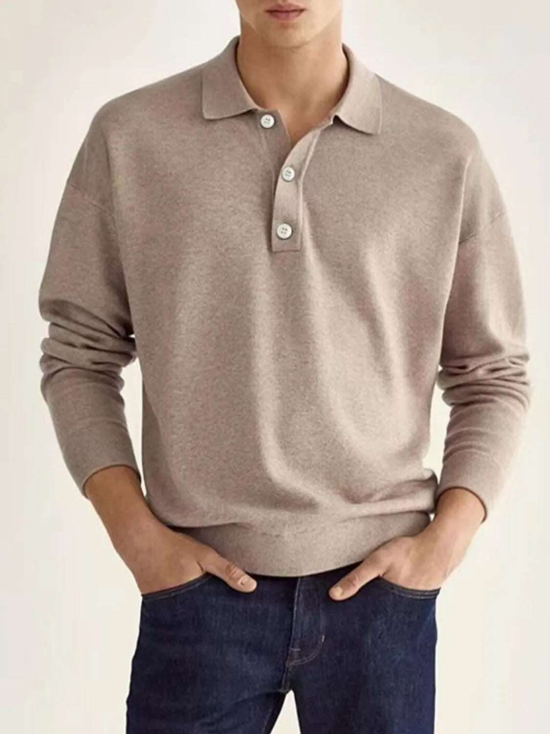 Relaxed knit polo shirt in taupe with buttoned placket and long sleeves.