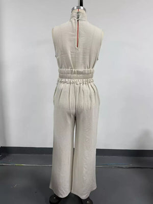 Sleeveless Wide-leg Jumpsuit With Smocked Waist in Apricot, model styling view
