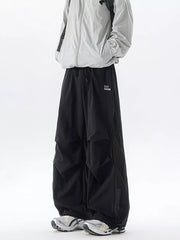 Black cargo sweatpants with adjustable waist and mesh panel detail