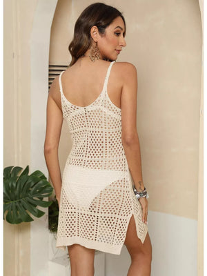 White openwork crochet knit cover-up dress with side slits, worn over a bikini.