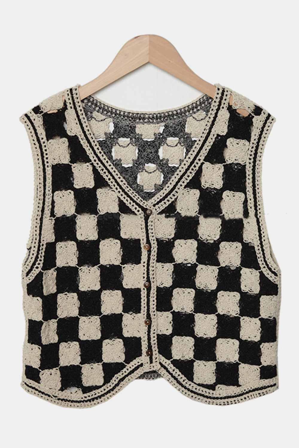 Checkerboard crochet vest in beige and black with button front and V-neck.
