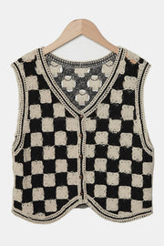 Checkerboard crochet vest in beige and black with button front and V-neck.