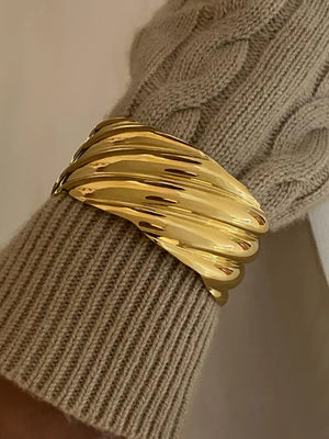 Gold cuff bracelet with sculpted wave detail, 18K gold-plated