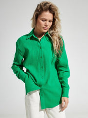 Green textured cotton overshirt with relaxed fit and button front.