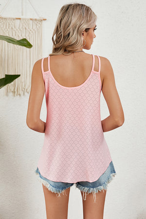 Pink camisole with double straps and allover perforated detail.