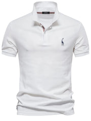 White piqué polo shirt with giraffe embroidery and striped collar detail.