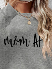 Mom At graphic sweatshirt in charcoal grey with crewneck and long sleeves.