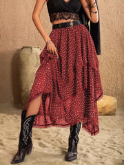 Burgundy polka dot tiered midi skirt with lace trim and a flowy silhouette.