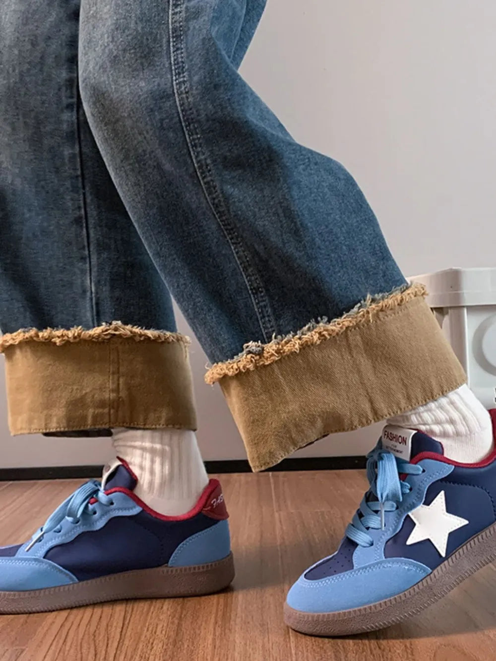 Blue and light blue retro sneakers with white star appliqué and red accents.