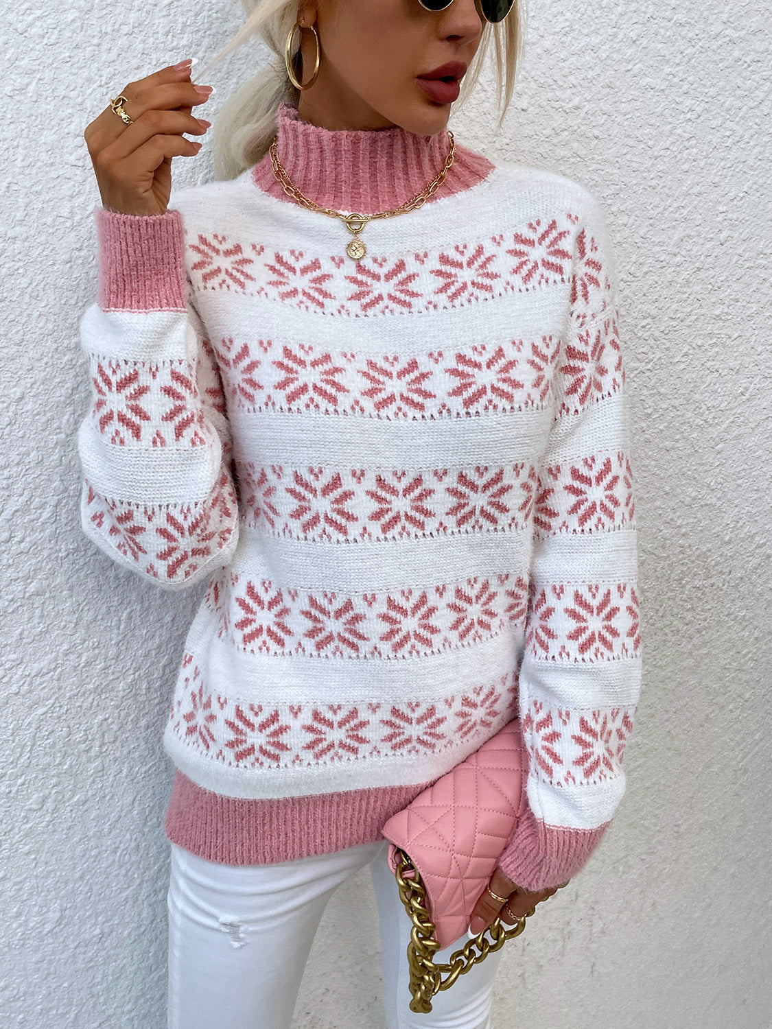 Carnation Pink and white fair isle mock neck sweater with a ribbed collar and cuffs.