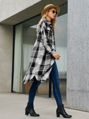Oversized black and white plaid shirt jacket dress with button front and high-low hem.