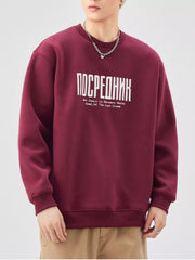 Maroon red oversized graphic sweatshirt with crewneck and ribbed cuffs and hem.