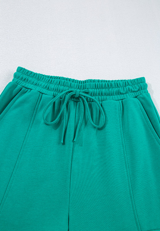Turquoise cargo pocket lounge set shorts with drawstring waist and pockets.