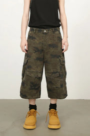 Camo culotte cargo shorts in green camouflage with multiple pockets.