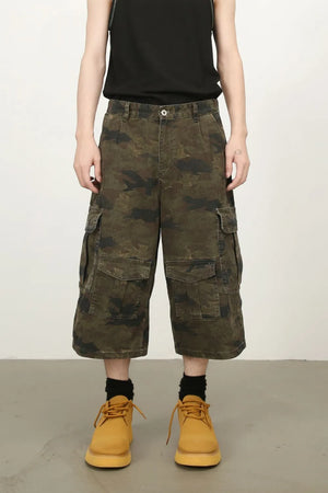 Camo culotte cargo shorts in green camouflage with multiple pockets.